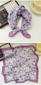Detailed macro of a purple floral cotton linen scarf with fine stitched edges and soft texture