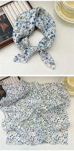 Floral print cotton linen scarf with blue flower pattern shown knotted and laid flat