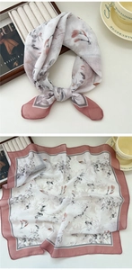 Detail of floral chiffon square scarf with light gray print and pink-purple borders