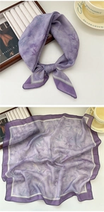 Detailed view of lilac scarf with bamboo leaf patterns and elegant purple border edge