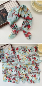 Detail of mint green floral cotton linen square scarf with red and yellow flower patterns