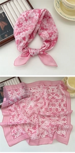Detailed view of pink floral chiffon neck scarf with intricate flower patterns and texture