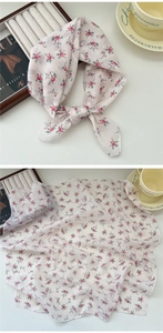 Detail of floral cotton linen neckerchief showing delicate print and soft texture