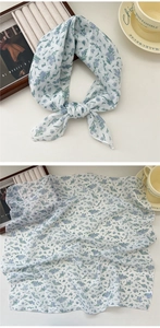 Detailed close-up of floral cotton-linen scarf with delicate blue and purple flower patterns