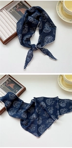 Detailed view of navy blue paisley scarf featuring delicate white scalloped lace edges