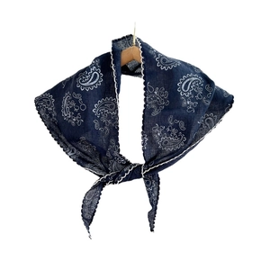 Navy paisley triangle scarf with white lace trim hanging on a wooden hanger