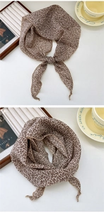 Detail of vintage brown floral cotton linen scarf with soft chiffon texture and rolled hem