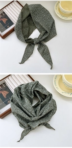 Detailed macro view of dark green floral cotton linen neckerchief with delicate print