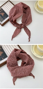 Detail of red floral cotton linen scarf with elegant stitching and vintage print