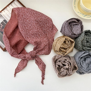 Floral print cotton linen neckerchief displayed in multiple colors on a white table
