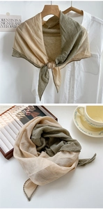 Detail of two-tone cotton linen scarf showing wavy scalloped edges and textured fabric