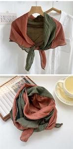 Detail of forest green and reddish-brown linen scarf with black lace crochet edge