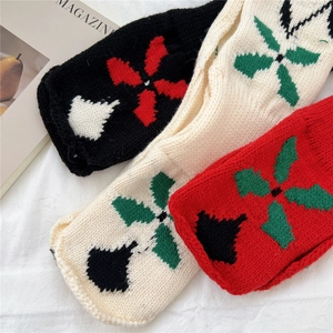 Short knitted floral neck warmer in black, beige, and red colors with textured patterns