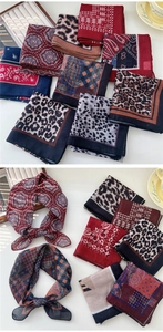 Vue détaillée de foulards en coton et lin léopard avec bordures roulées raffinées