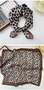 Détail d'un foulard léopard montrant la texture soyeuse et les bords ourlés fins