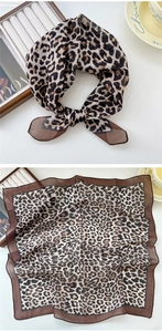 Détail d'un foulard en soie léger avec motif léopard classique et bordure marron