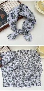 Detail of square cotton linen scarf with purple berry patterns and delicate borders