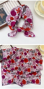 Detailed view of floral cotton linen square scarf with vibrant red and purple flower prints