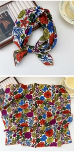 Detailed view of floral cotton linen square scarf with vibrant colors and orange edges
