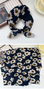 Detail of square navy cotton scarf with beige poppy floral pattern and textured finish