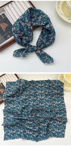 Detailed view of dark teal floral cotton linen small square scarf with delicate patterns
