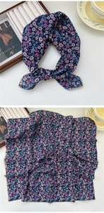 Detailed view of dark blue floral cotton silk scarf with daisy patterns and fine stitching