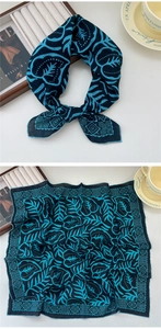 Detail of navy cotton linen square scarf featuring tropical blue leaf prints and dots
