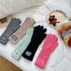 Thick knitted winter gloves for women in multiple colors with cute bear label patches