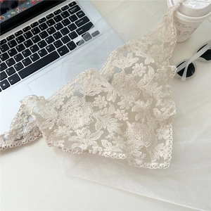 Lace embroidery floral scarf on desk with laptop and coffee for a modern lifestyle look