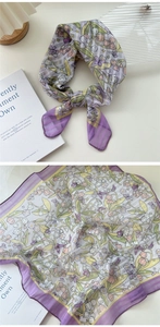 Detail of lavender floral scarf showing delicate butterfly prints and soft texture