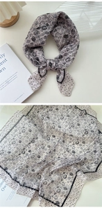 Detail of vintage floral cotton linen scarf with black roses and polka dots