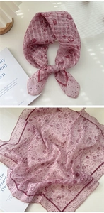Detailed view of pink floral cotton linen scarf with vintage red rose and polka dots