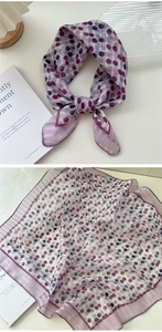 Detailed texture of purple polka dot cotton linen scarf showing soft fabric and draped knot