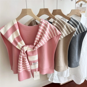 Striped knit shawl and vest set for women in pink, beige and grey displayed on hangers
