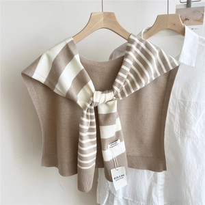 Detail of striped knit shawl showing soft texture and high-quality ribbed edges