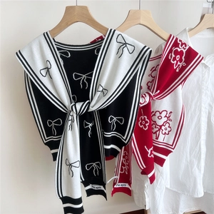 Floral knitted shawl wrap for women featuring contrast stripes and tie-front bow design