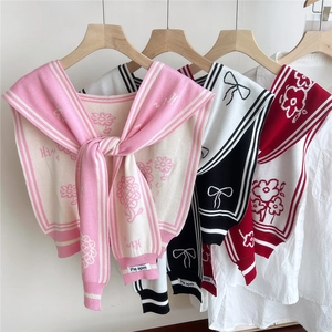 Floral knit shawl wrap set in pink, black, and red displayed on white shirts