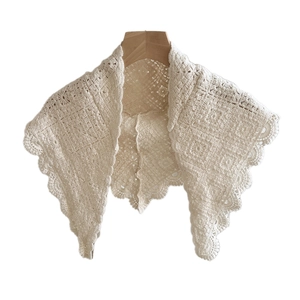Vintage crochet cotton shawl with cream floral hollow patterns for a retro aesthetic