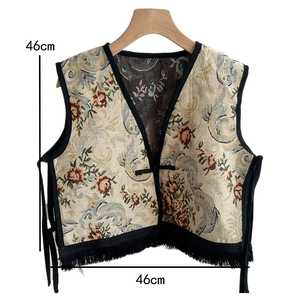 Detailed view of ethnic jacquard vest with floral patterns, tassels, and 46cm dimensions