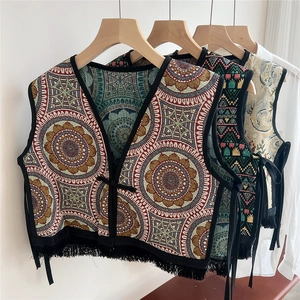 Ethnic embroidered vest wrap with bohemian mandala patterns and black fringe tassels