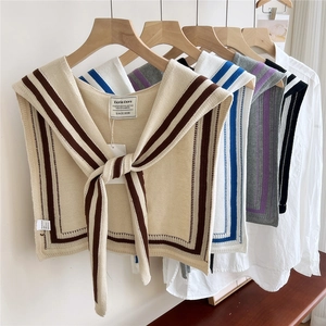 Striped knit shawl collar in beige, white, grey, and black with nautical sailor lace-up