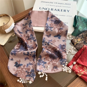 Elegant dusty pink silk scarf with floral butterfly prints and pearl tassel accents