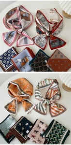 Detailed close-up of diverse silk-feel scarves featuring horse and floral patterns