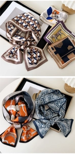 Detailed close-up of silk scarves featuring equestrian prints and vintage geometric patterns