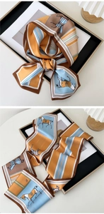 Detail of silk long scarf featuring equestrian horse pattern and striped edges