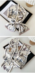 Detail of silk narrow scarf with vintage equestrian prints and delicate hemmed edges