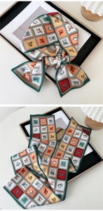 Macro detail of silk scarf featuring British equestrian horse print and vintage patterns