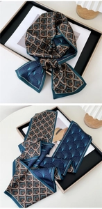 Detailed view of patterned silk ribbon scarf with geometric and fan prints for styling