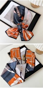 Detailed view of silk-like Twilly scarf with equestrian print and refined black edges