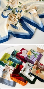 Close-up of elegant square silk scarves with various artistic floral and ink patterns